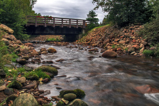 River bridge rocks trees background - a bridge in the background free wallpaper