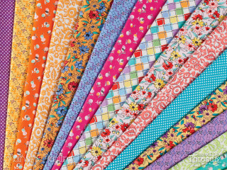 Colored fabrics close up table - a close up of a bunch free wallpaper