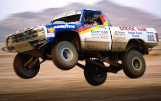 Truck jumping mountain sky background - eric dinyer free wallpaper
