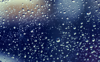 Rain covered window drops blurry - a close up of a rain free wallpaper