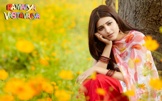 Woman sitting field flowers hand - movie still frame free wallpaper