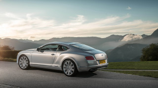 Silver car parked mountains clouds - a silver car free wallpaper