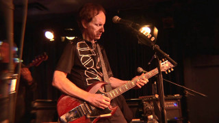 Man playing guitar microphone stand - a guitar in front free wallpaper