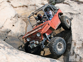 Jeep driving rocky area man - epic scale free wallpaper