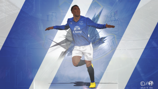 Man blue shirt kicking soccer - a soccer ball free wallpaper