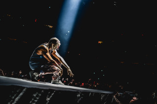 Man stage microphone crowd watching - renaissance free wallpaper