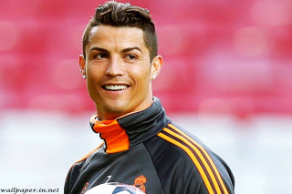 Man holding soccer ball smiling 2 - a soccer ball free wallpaper