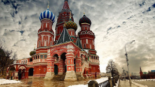 Large red building towers clock - architecture free wallpaper