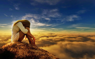 Woman rock clouds sky bright - somber free wallpaper