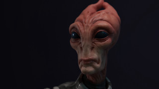 Red alien mask closeup black - redshift free wallpaper