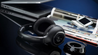 Headphones table laptop magazine cellphone - product photo free wallpaper