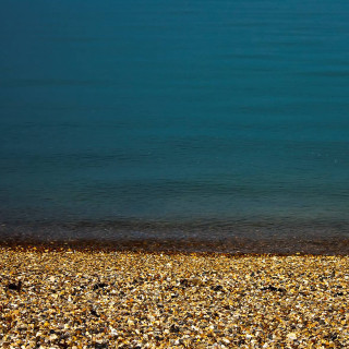 Beach person surfboard water pebbles - the sand free wallpaper