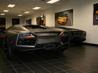Car showroom parking man standing - a showroom free wallpaper