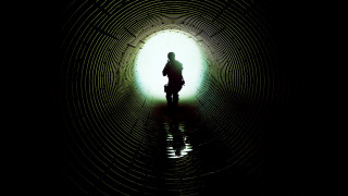 Person standing dark tunnel bike - the end free wallpaper