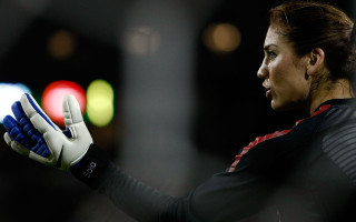 Woman holding glove blurry background - a glove free wallpaper