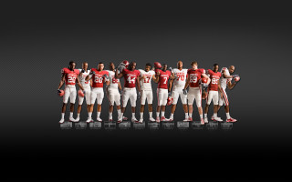 Football players arms in air - a group of football players free wallpaper