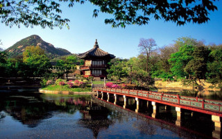 Bridge water pagoda mountain trees - a bridge over a body of water free wallpaper