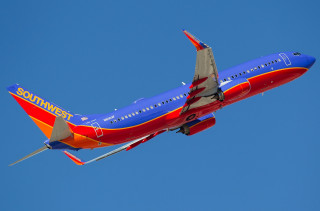 Southwest airlines plane flying sky - turnaround free wallpaper