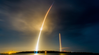 Rocket launch long exposure night - a city in the background free wallpaper