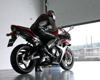 Man leather outfit motorcycle garage - a helmet free wallpaper