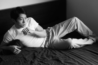 Man laying bed hands chest - his leg free wallpaper
