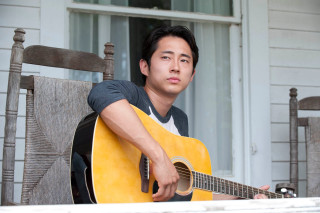 Man playing guitar outside house - outside free wallpaper