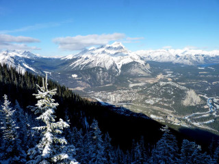 Mountain range snow trees background - a view of a mountain range free wallpaper
