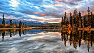 Lake trees mountains cloudy sky - a colorful sky free wallpaper