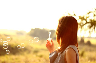 Woman blowing bubbles tree field - grass and trees free wallpaper