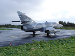 Fighter jet runway grass trees - a cloudy day free wallpaper