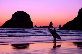 Beach sunset surfboard rock formation 2 - a surfboard free wallpaper