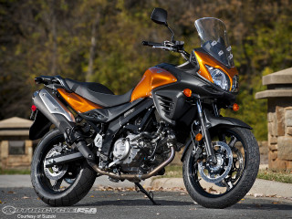 Motorcycle parked road stone wall - cobra free wallpaper