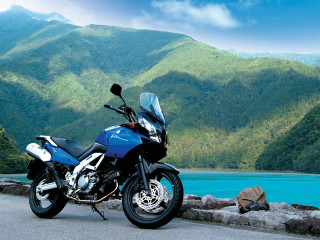Motorcycle parked lake mountains blue - digital free wallpaper