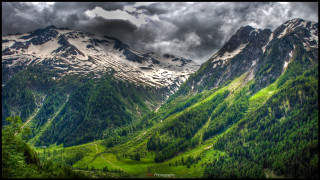 Mountain range valley forest cloudy - a few cloud above free wallpaper