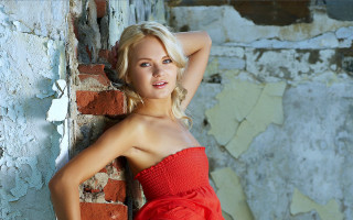 Woman red dress brick wall 5 - leaning free wallpaper