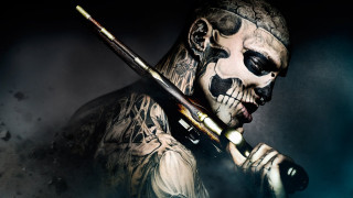 Man skull face paint paintbrush - his hand and a skull free wallpaper