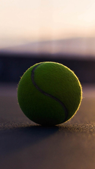 Tennis ball ground blurry background - a tennis ball free wallpaper