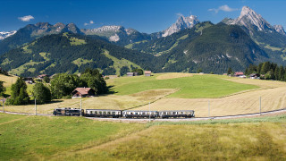 Train countryside mountains trees sunny - a lush green countryside next free wallpaper