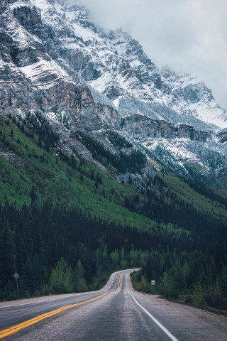 Mountain road yellowline cloudy sky - cloudy free wallpaper