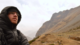 Mountain man blackjacket sunglasses outdoors - a cloudy sky in the background free wallpaper