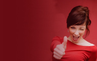 Red shirt woman thumb up - a red wall free wallpaper