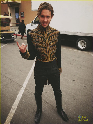 Man black gold outfit parking - free vintage wallpaper