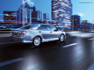 Silver car night city blur - a silver car free wallpaper