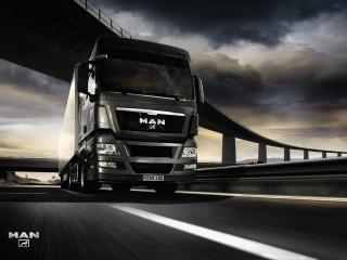 Truck driving highway cloudy sky - a bridge in the background free wallpaper