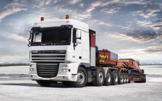 Semi truck parking snow cloudy - a trailer free wallpaper