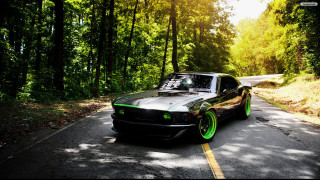 Car parked woods green rims - the side of a road free wallpaper