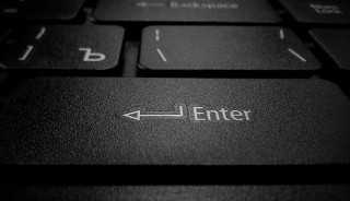 Close up keyboard enter button - left free wallpaper