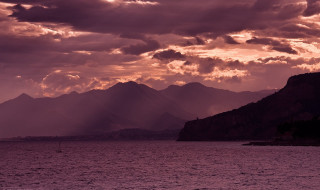 Boat water cloudy sky mountains 2 - dramatic light free wallpaper