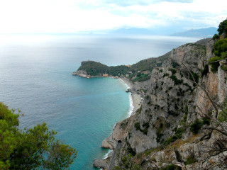 Beach view cliff ocean boat - a view of a beach free wallpaper