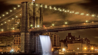 Bridge waterfall night lights buildings - long exposure free wallpaper